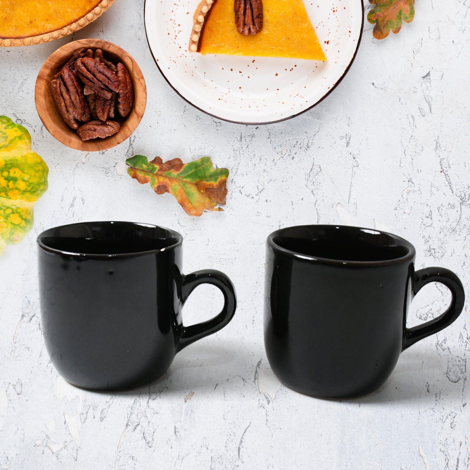 Black ceramic tea cup mug set with elegant design for enjoying hot beverages at home