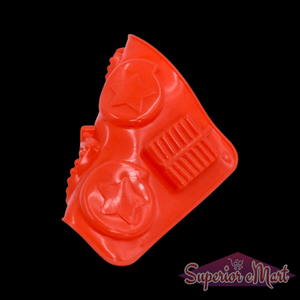 Red silicone chocolate mold tray with star shapes and bars for creative baking projects