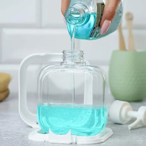 Clear pump lotion bottle 1 pc with liquid being poured into it and a stylish countertop setting