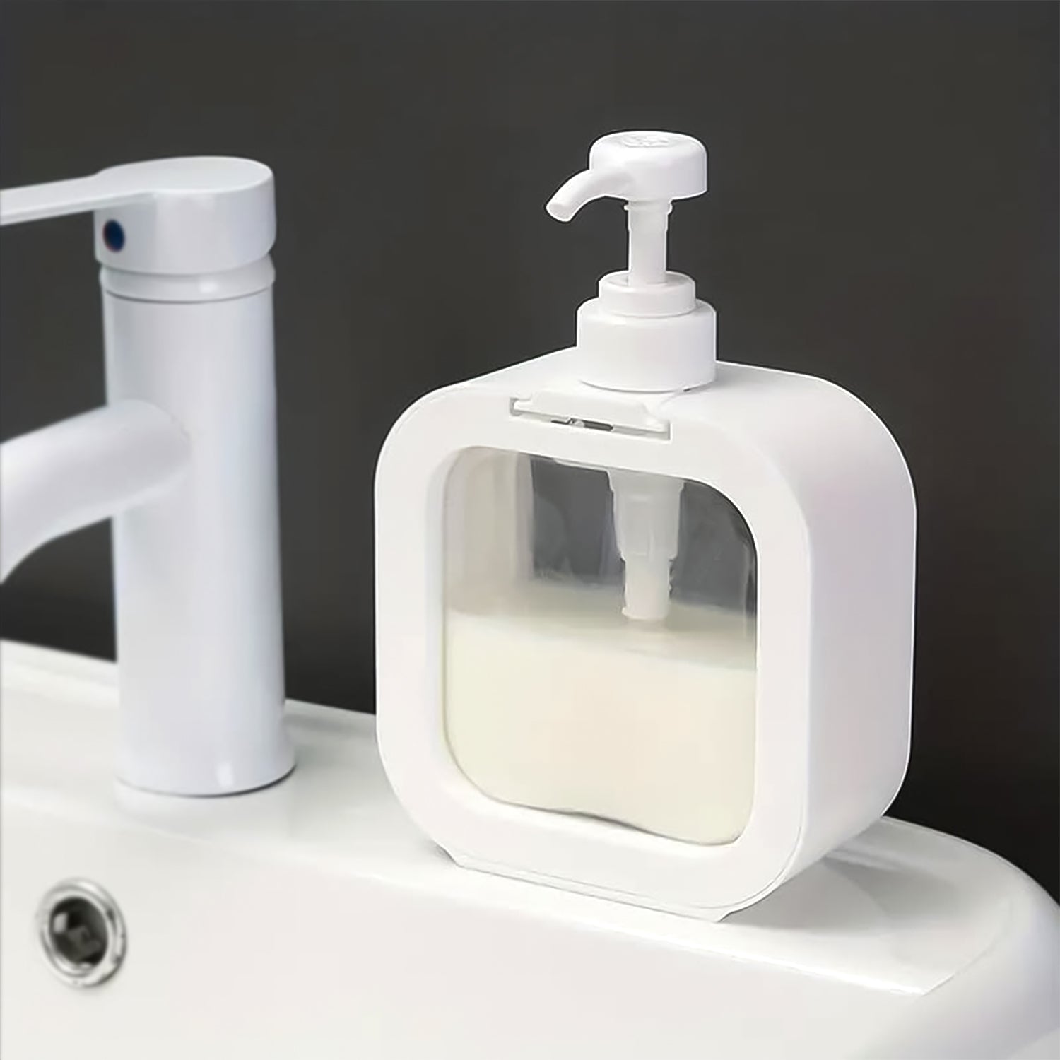 Clear pump lotion bottle 1 pc on a bathroom counter beside a faucet for easy dispensing