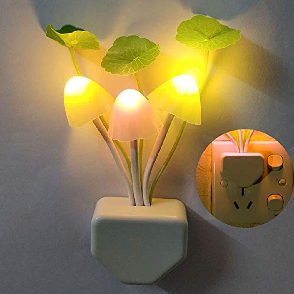 Colorful mushroom night light featuring three glowing mushrooms and decorative leaves for a cozy atmosphere