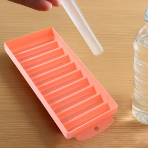 Compact ice stick tray in pink with easy-release design for making ice sticks