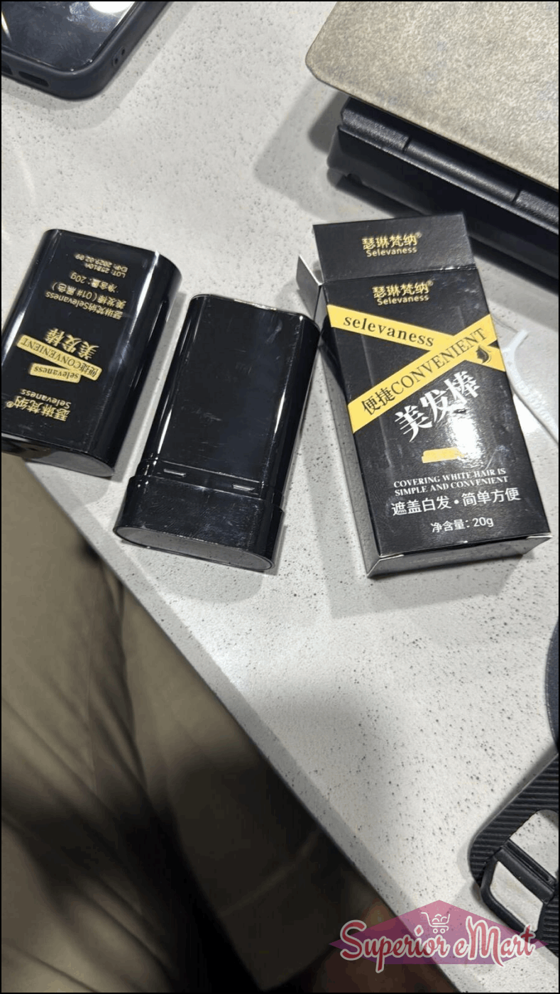 Black Selevaness hair color touch-up stick and box for covering gray hair. Gold text on black packaging. 20g.