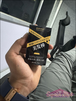 Selevaness hair color stick for covering white hair. Black box with yellow diagonal stripes and gold branding.