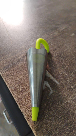 Cute umbrella tea strainer in stainless steel with a bright green handle for easy brewing