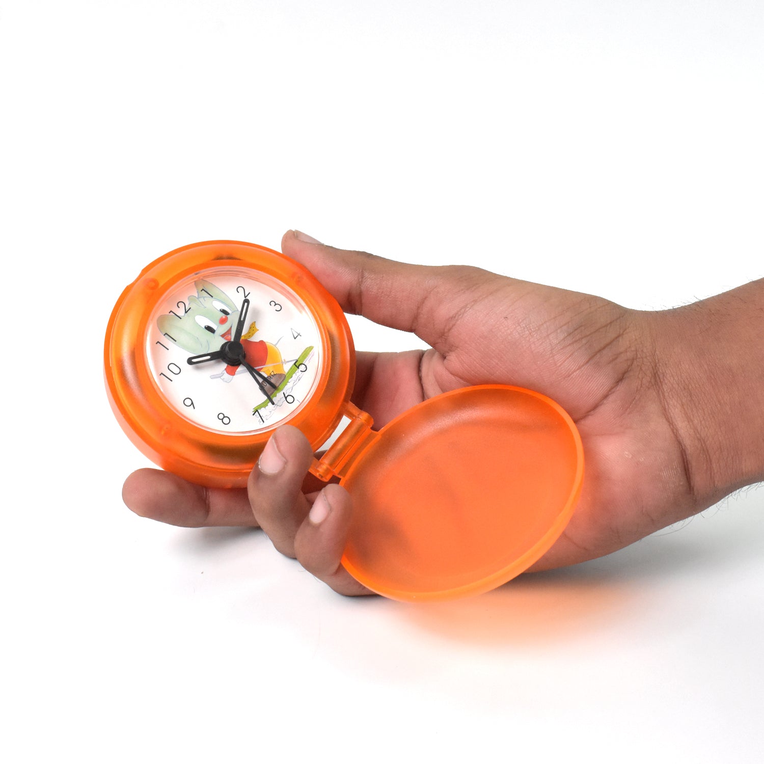 Bright orange decorative clock for every room with a playful design held in a hand