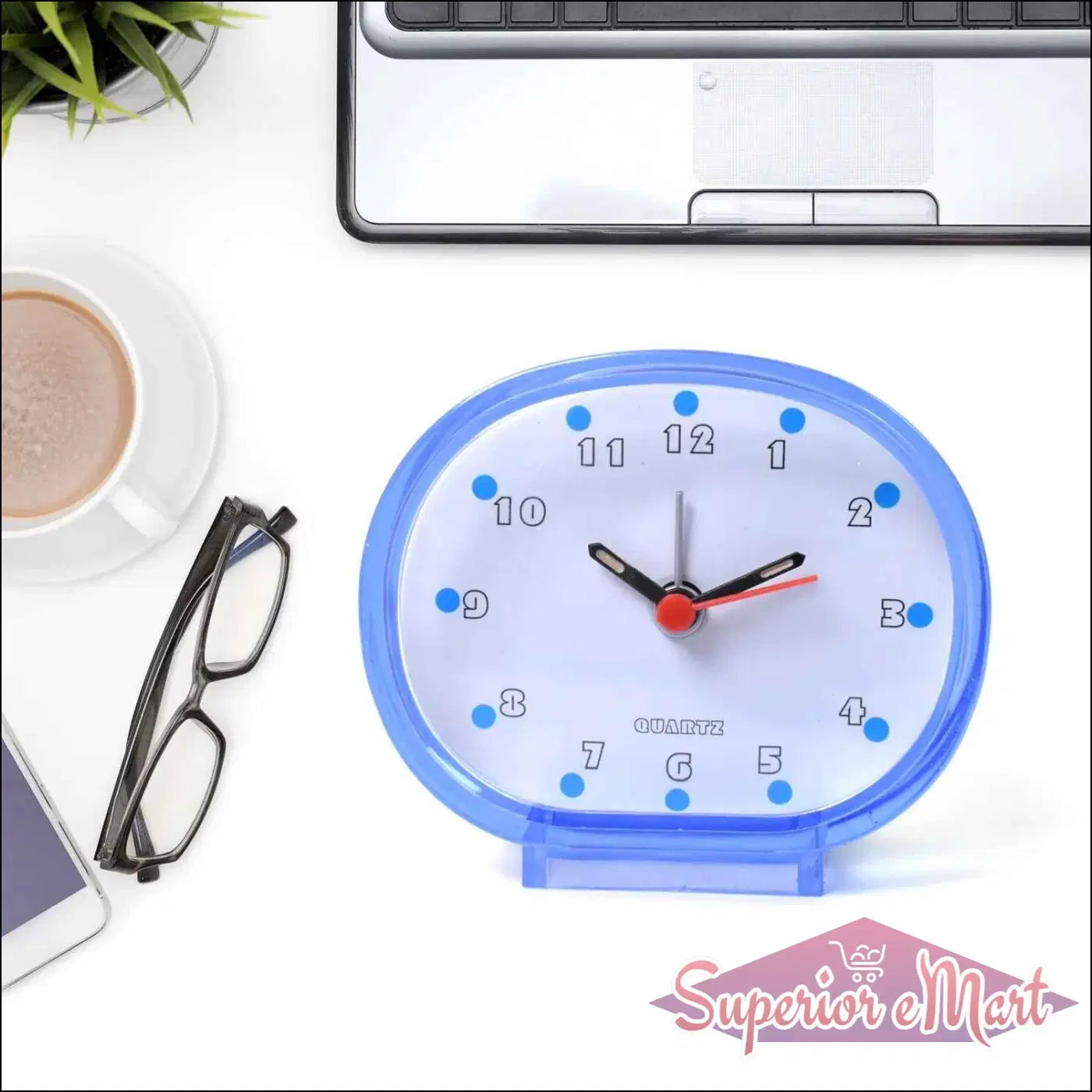 Blue decorative clock on desk with coffee and glasses, ideal decorative clocks for every room
