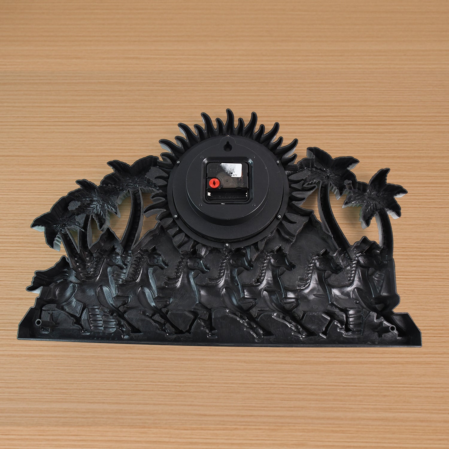 Decorative wall clock with a tropical design featuring palm trees and silhouettes for stylish home decor