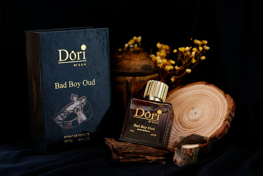 Bad Boy Oud Men Parfume by Dori with an elegant box set on natural wood backdrop