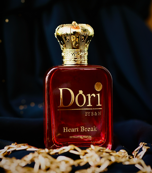 Heart Break Unisex Parfume in a luxurious red bottle with a golden crown cap from Superior eMart