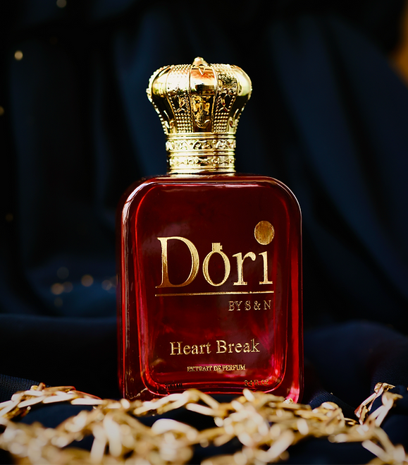 Heart Break Unisex Parfume in a luxurious red bottle with a golden crown cap from Superior eMart