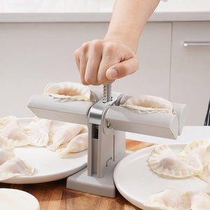 Double head dumpling maker in use, easily sealing dumplings for perfect homemade meals