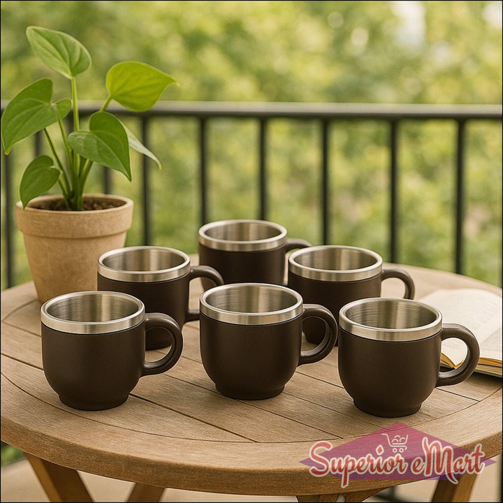 Set of black double wall stainless steel mug set on a wooden table with plant in background