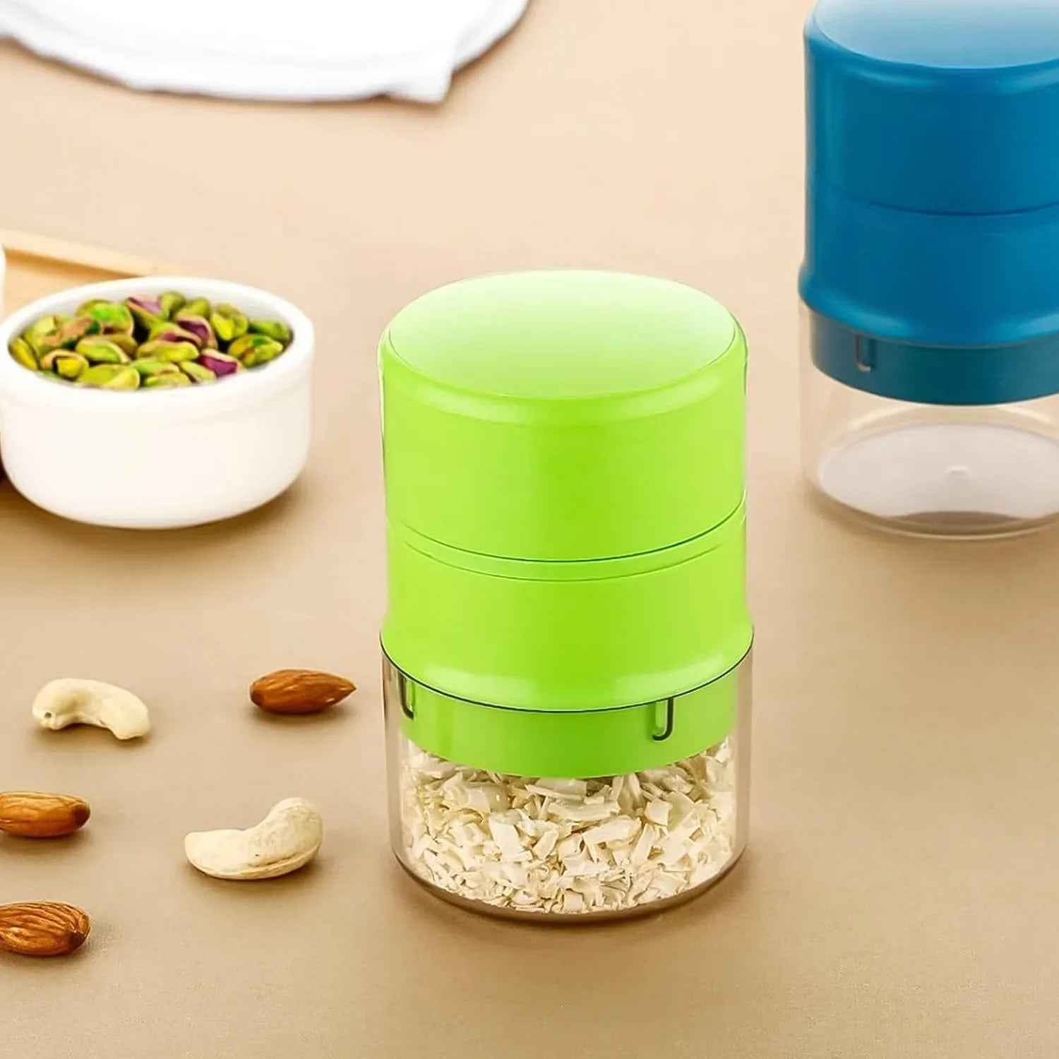 Green and blue dry fruit cutter tool for easy chopping of nuts and dried fruits in the kitchen