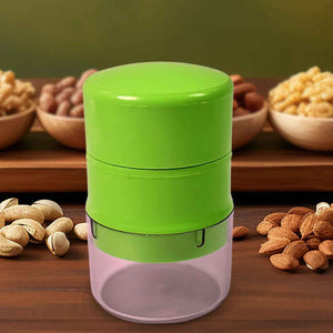 Green dry fruit cutter tool for easy chopping of nuts and dried fruits in the kitchen