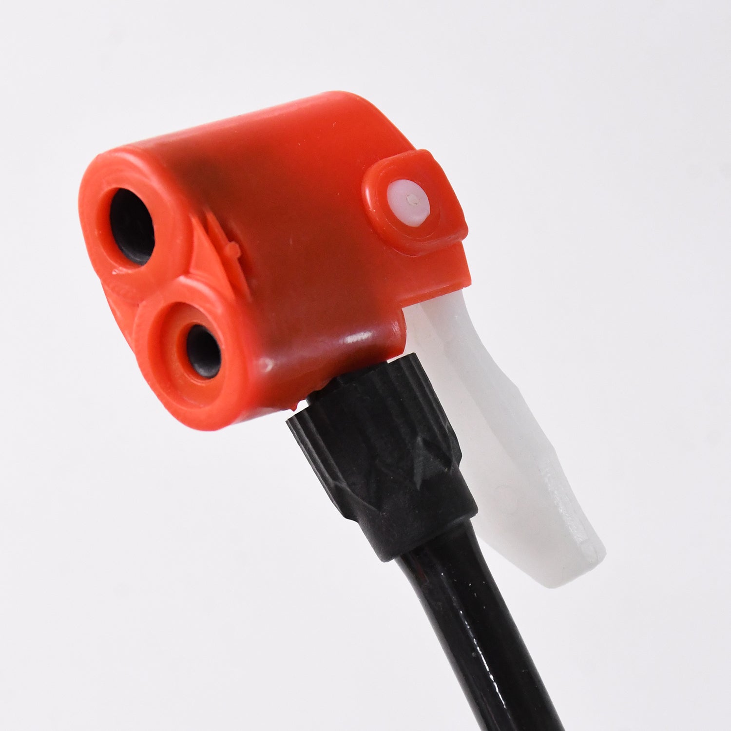 Close-up view of a dual nozzle bike pump head designed for easy tire inflation