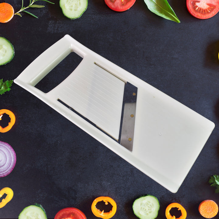 Adjustable fruit and vegetable slicer with stainless steel blade for precise slicing and dicing