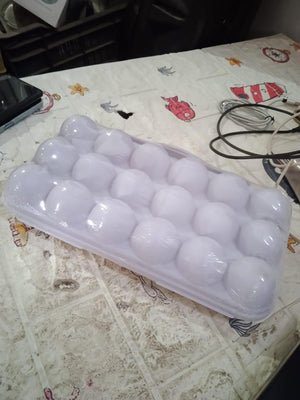Clear 18 grid egg holder for fridge designed to keep eggs organized and fresh