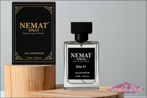 Nemat Elite X7 50ml Eau de Parfum bottle and black box with gold accents on a wooden pedestal. Clear glass, black cap.