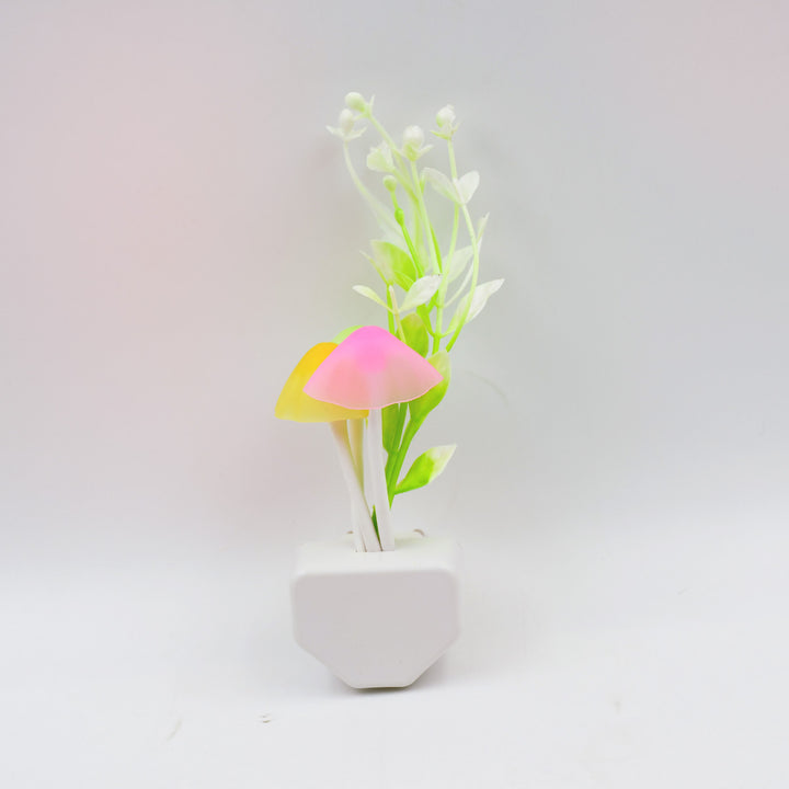 Fancy LED illumination light in decorative pot with vibrant mushroom design and faux greenery
