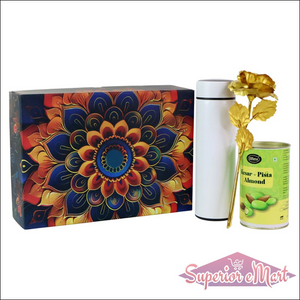 Colorful festive gift hamper box featuring a decorative design, a tea canister, and a tin of pistachio almonds