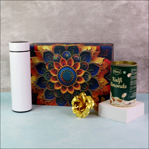 Festive gift hamper box featuring a decorative design, kulfi almonds, and a stylish white thermos
