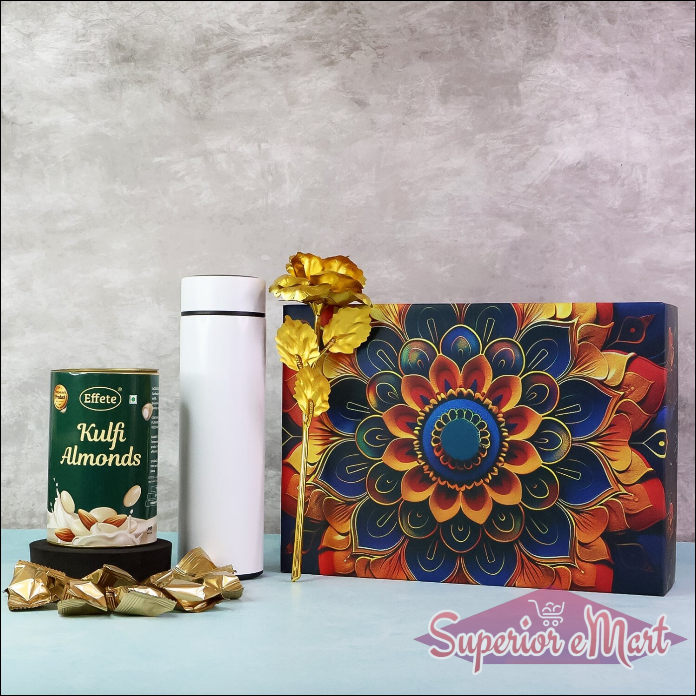 Festive gift hamper box with colorful design, kulfi almonds, and decorative items for special occasions