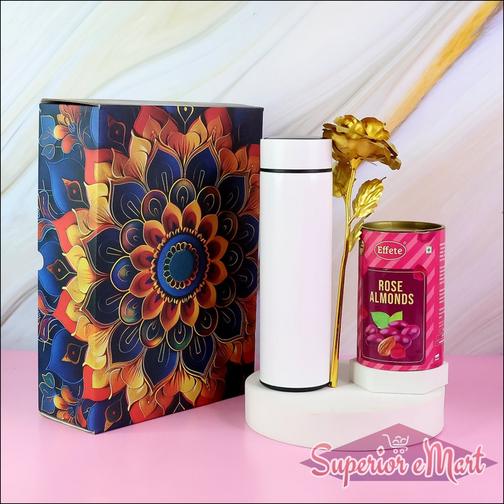Festive gift hamper with stainless steel bottle, decorative flower, and rose almonds in an elegant box