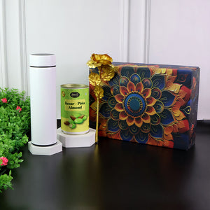 Festive gift hamper box featuring a decorative design, pistachio can, and elegant flower arrangement