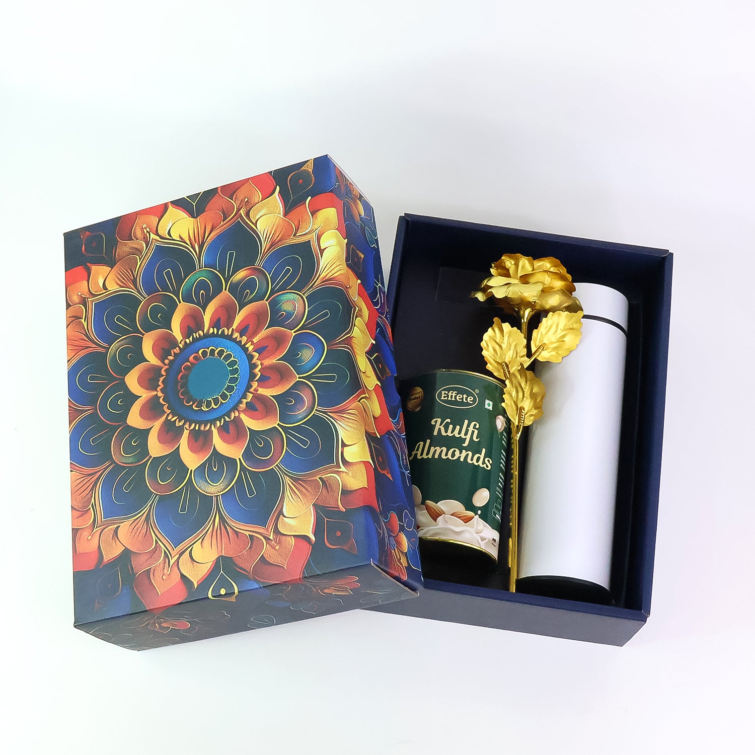 Festive gift hamper box featuring colorful design with Kulf almonds and decorative item inside