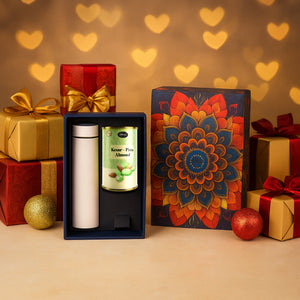 Festive gift hamper with stainless steel bottle and gourmet almonds in an elegant box with decorative gifts