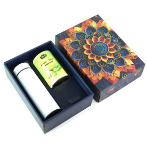 Festive gift hamper with stainless steel bottle featuring colorful floral packaging and tea canister