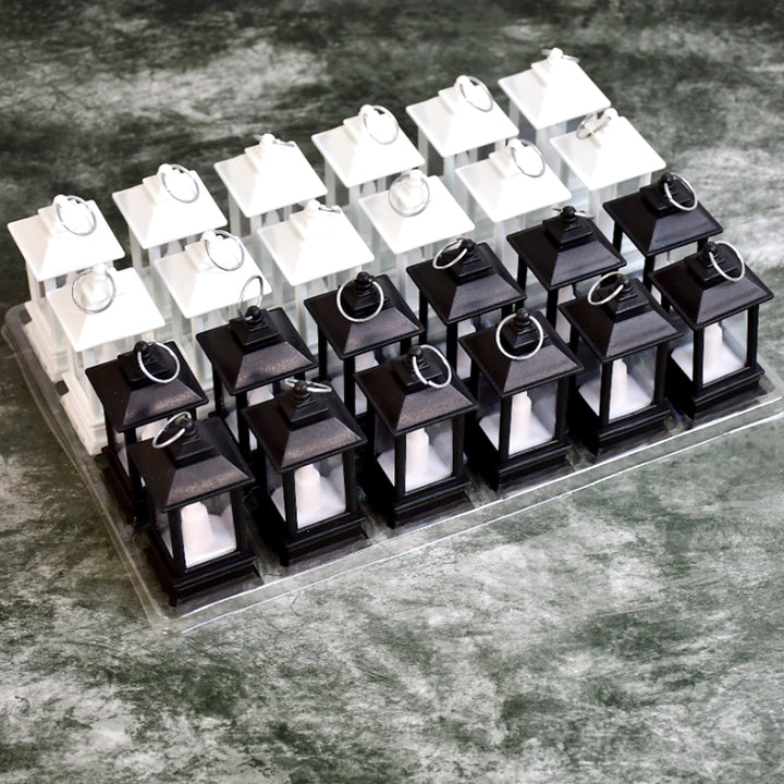 Flameless candle lantern pack featuring black and white lanterns with candle inserts for safe decor