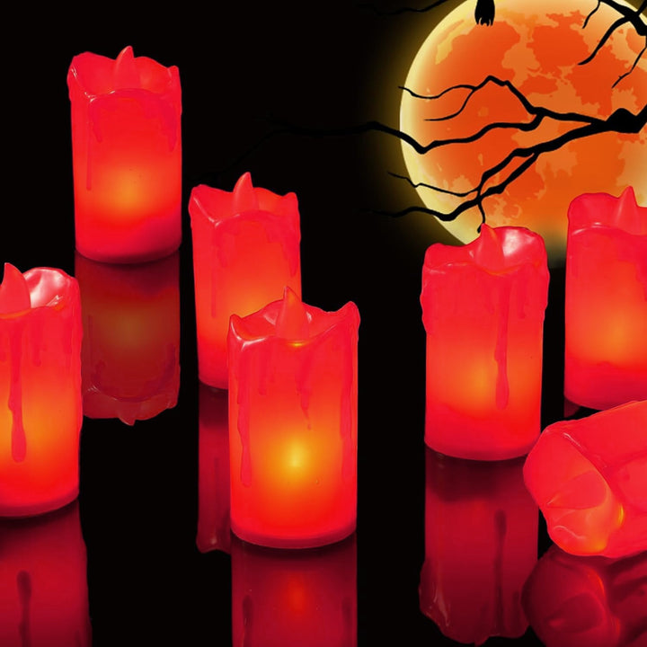 Set of red flameless decorative candles glowing softly for Halloween home decor