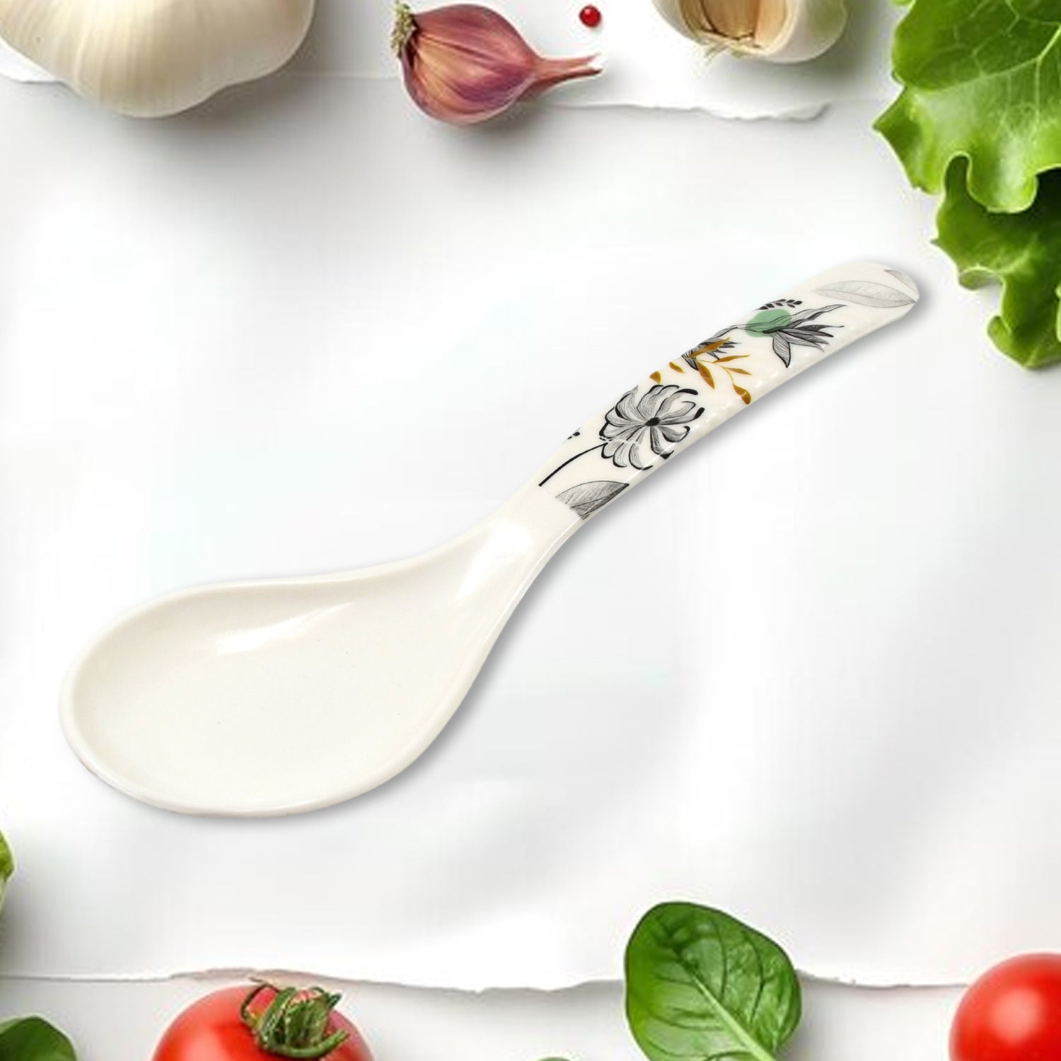 Ceramic spoon with floral design from Superior eMart 11 piece tableware dinner set surrounded by fresh vegetables