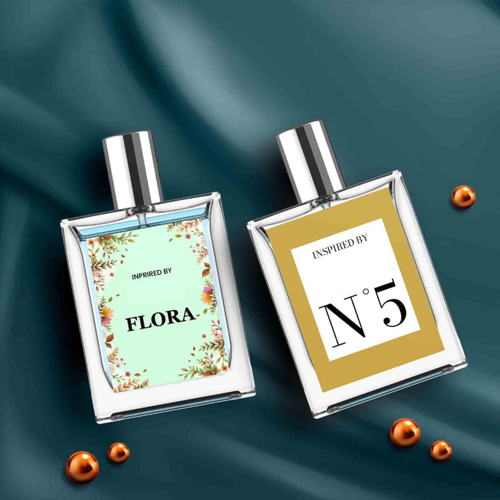 Florra & N5 Inspired Perfumes in Elegant Bottles with Floral and Gold Labels on Fabric Background
