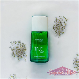 True Musk perfume 30ml in a green glass bottle surrounded by delicate flowers