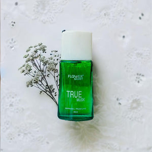 True Musk perfume 30ml in a green bottle with a white cap and floral background