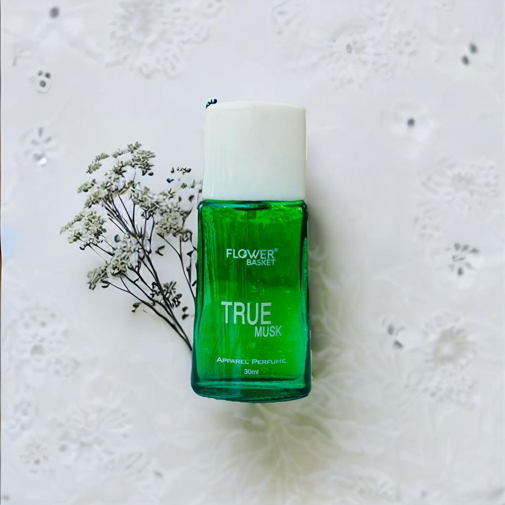 True Musk perfume 30ml in a green bottle with a white cap and floral background