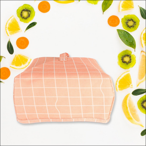 Foldable food cover in pink grid design for keeping food fresh and protected outdoors