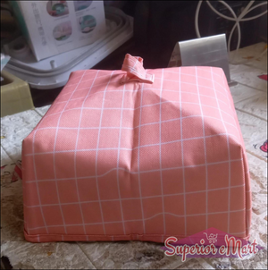 Foldable food cover in pink grid design for protecting meals and snacks from insects