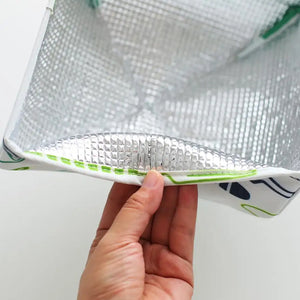 Close-up of a foldable food cover for kitchen with a reflective interior and vibrant design