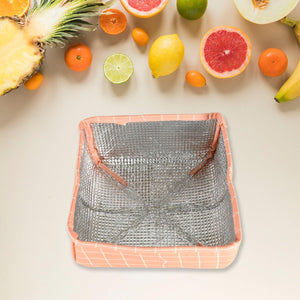 Foldable food cover in peach and silver design ideal for protecting fruits and dishes outdoors