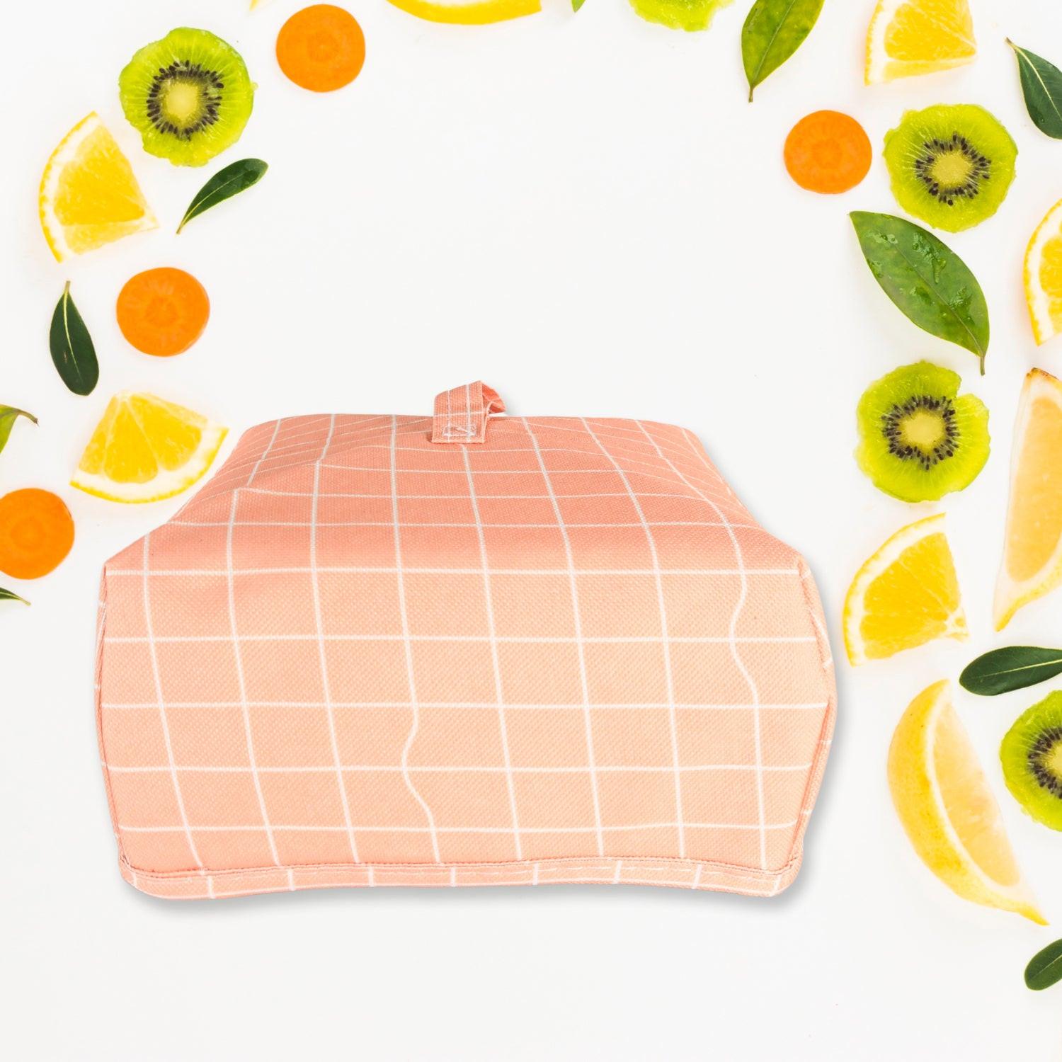 Foldable food cover in pink grid design for keeping food fresh and protected outdoors