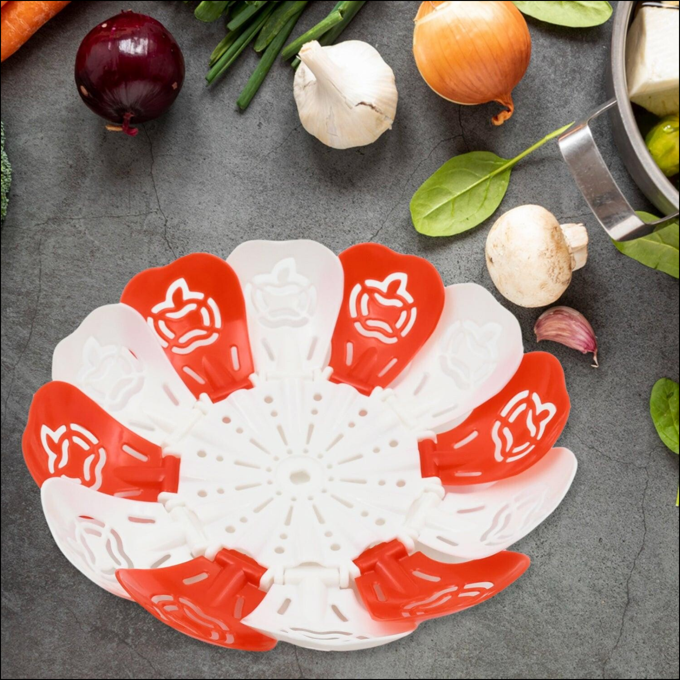 Innovative folding fruit basket for kitchen with vibrant red and white design for easy storage