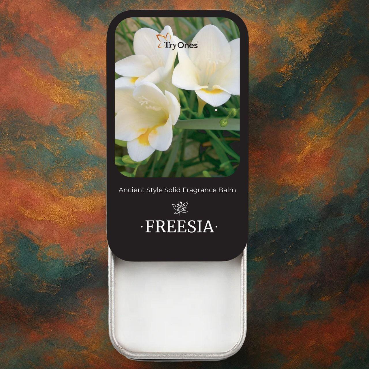 Ancient style solid perfume in a sleek tin featuring freesia flower scent for a timeless fragrance experience