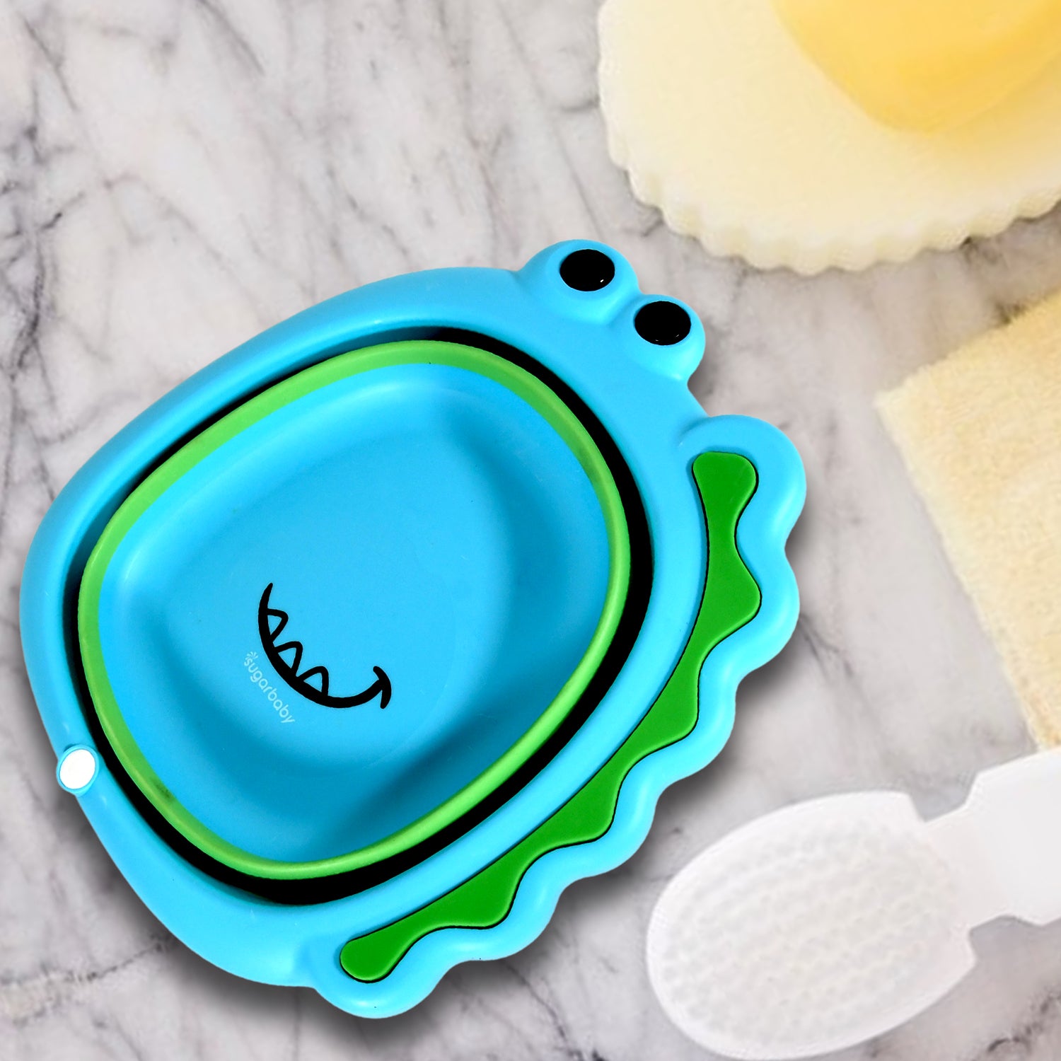 Frog shape baby wash basin in blue and green, designed for safe and fun bath time use