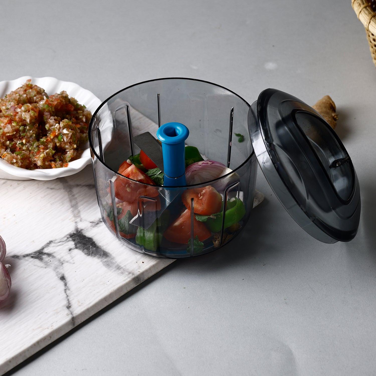 Lock unlock push chopper filled with fresh vegetables for easy meal preparation