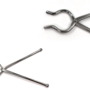 Stainless steel utensil holder tongs designed for easy gripping and serving in the kitchen