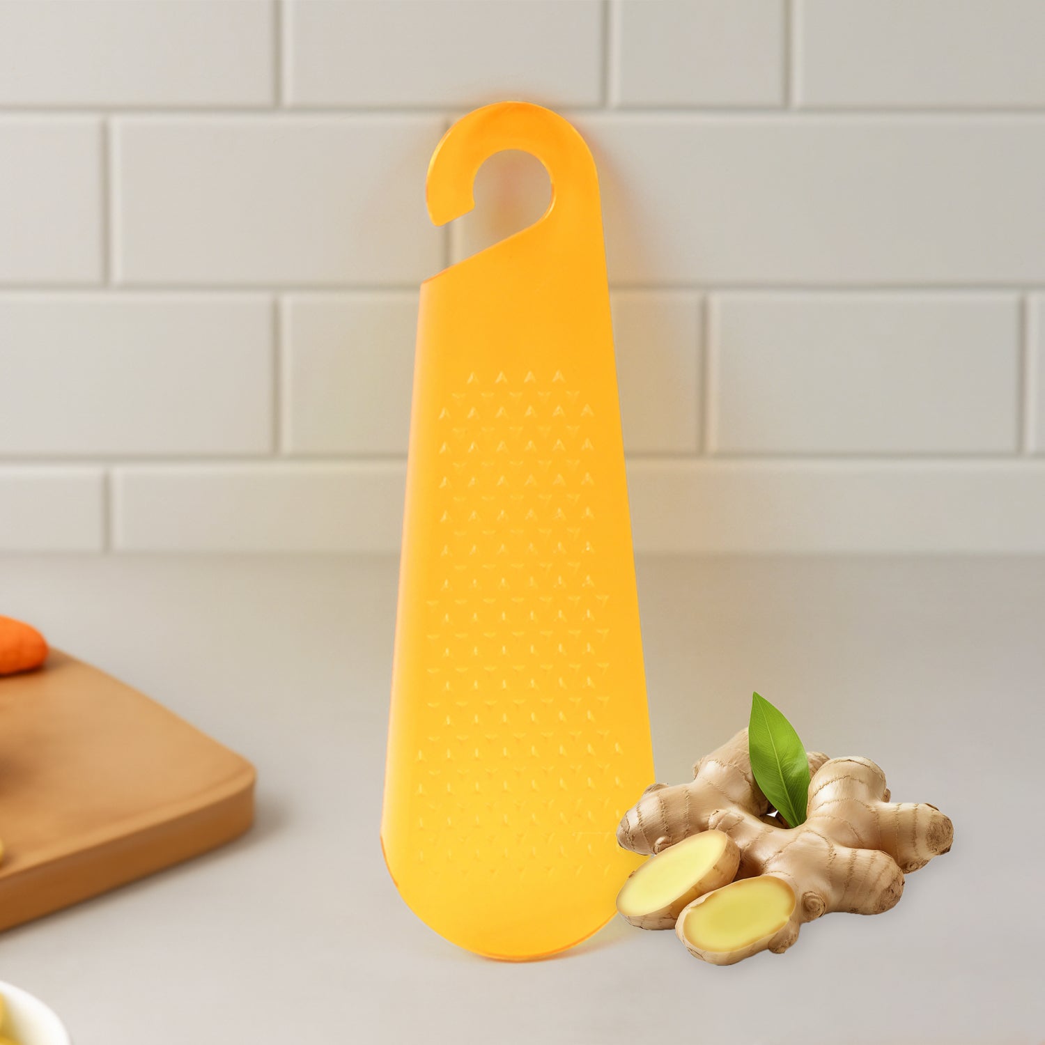 Yellow silicone garlic and ginger grater tool for easy kitchen use and effective grating